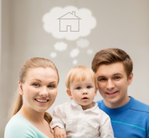 home, real estate and family concept - family with child dreaming