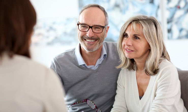 Senior couple meeting financial adviser for investment